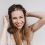 Joyful european woman laughing on white backgorund during photoshoot. Indoor photo of romantic girl expressing happiness.